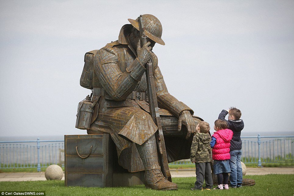 Children meeting the much larger than life Tommy sculpture