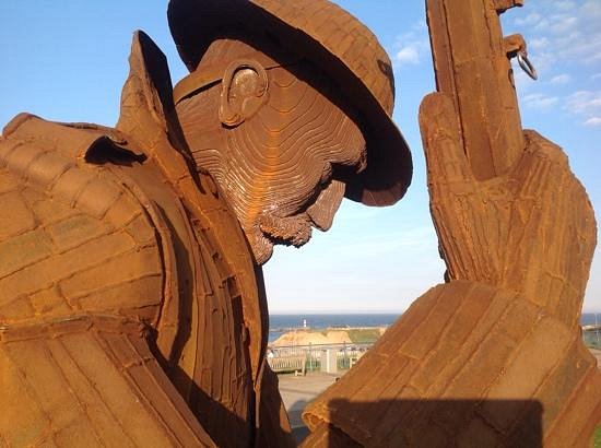 Detail of Tommy's downcast face and steel construction